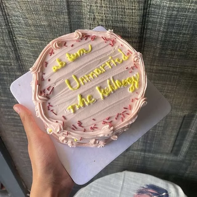 Custom funny marriage cake with 'We are Unhappy The Kellys' humorous message - Humorous Wedding Cakes Karachi By Whisk And Sift
